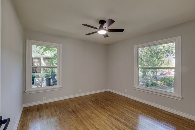 unfurnished room featuring hardwood / wood-style flooring and ceiling fan