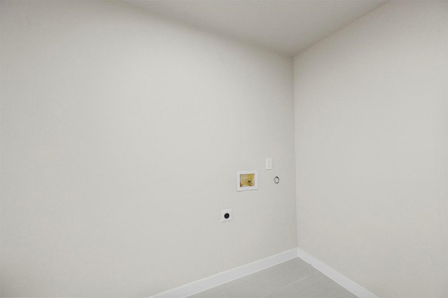 laundry area with light tile patterned flooring, washer hookup, and hookup for an electric dryer