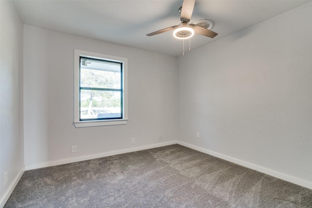 unfurnished room with ceiling fan and carpet floors