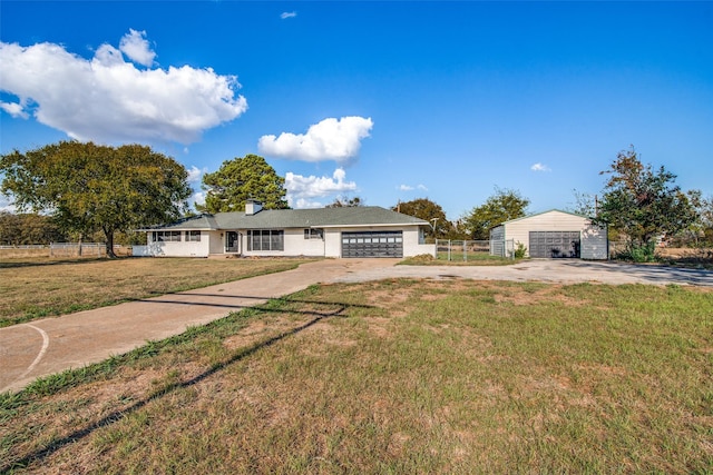 ranch-style home with a garage and a front yard