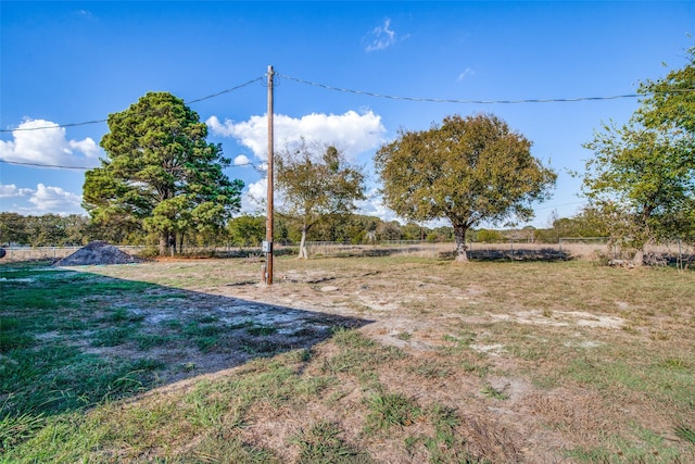 view of yard with a rural view