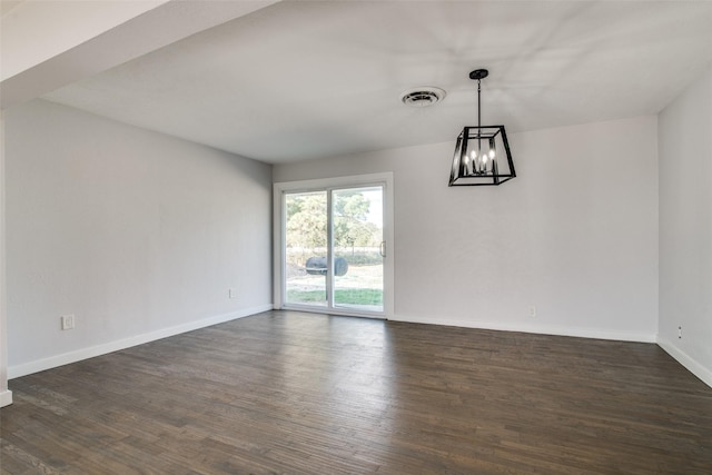 spare room featuring dark hardwood / wood-style floors