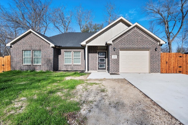 single story home featuring a garage and a front yard