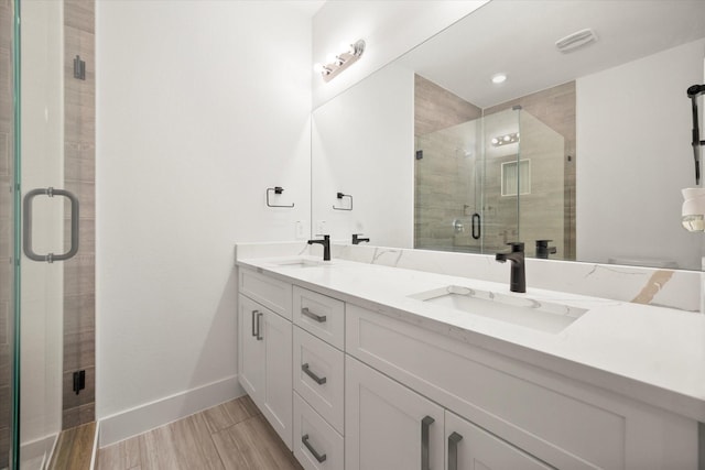 bathroom with vanity and walk in shower