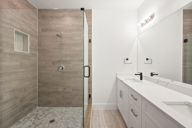 bathroom with vanity and an enclosed shower