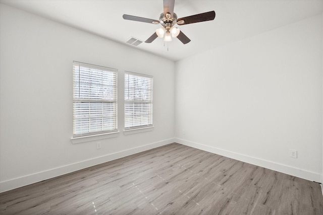 spare room with ceiling fan and light hardwood / wood-style flooring