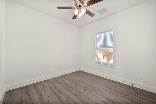 unfurnished room with ceiling fan and wood-type flooring