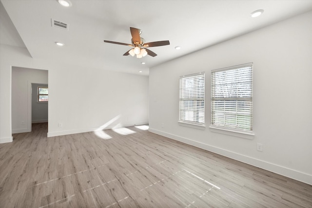 unfurnished room featuring light hardwood / wood-style floors and ceiling fan