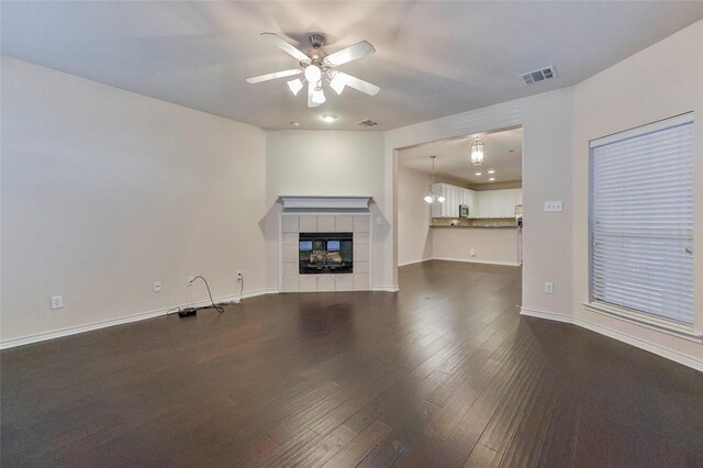 empty room with hardwood / wood-style floors and ceiling fan