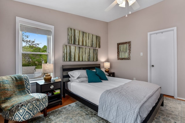 bedroom with hardwood / wood-style flooring and ceiling fan