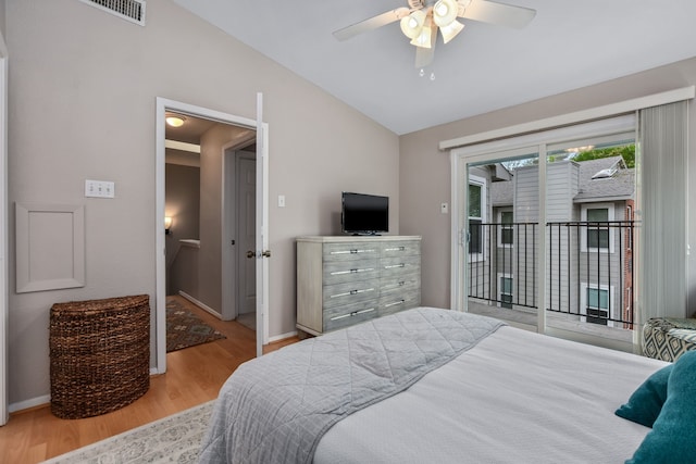 bedroom featuring ceiling fan, lofted ceiling, access to outside, and light hardwood / wood-style flooring