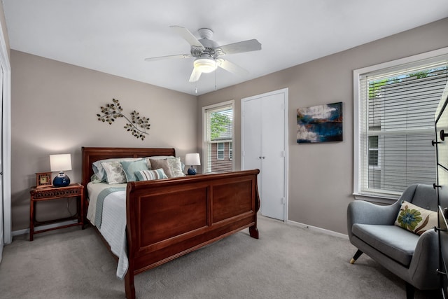 bedroom featuring ceiling fan and light colored carpet