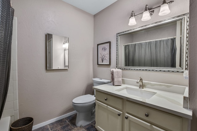 bathroom with vanity, a shower with shower curtain, and toilet