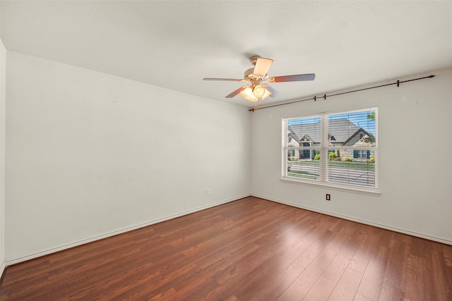 empty room with hardwood / wood-style flooring