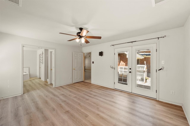 unfurnished room featuring ceiling fan, light hardwood / wood-style flooring, and french doors