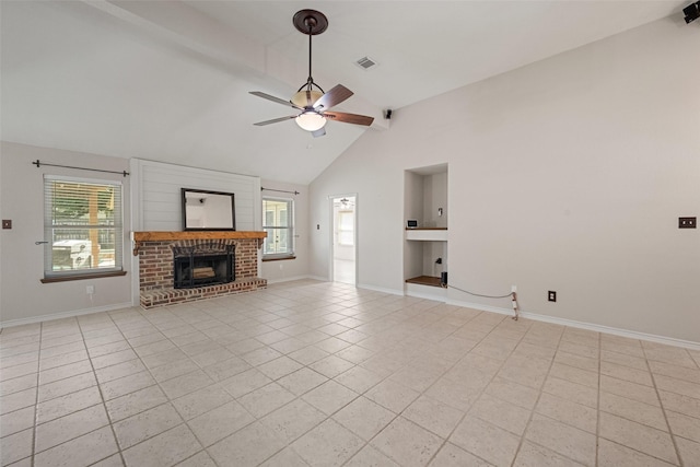 unfurnished living room featuring a wealth of natural light, light tile patterned floors, and ceiling fan