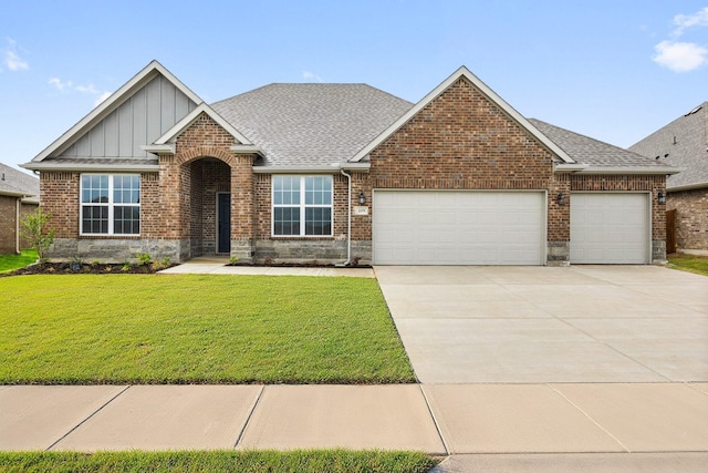 209 Briarwood Dr, Nevada, TX 75173 - view of front of house featuring a garage, board and batten siding, driveway, a front yard, and brick siding