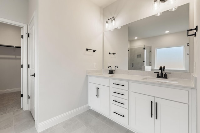 209 Briarwood Dr, Nevada, TX 75173 - bathroom featuring a shower stall, double vanity, a spacious closet, and recessed lighting