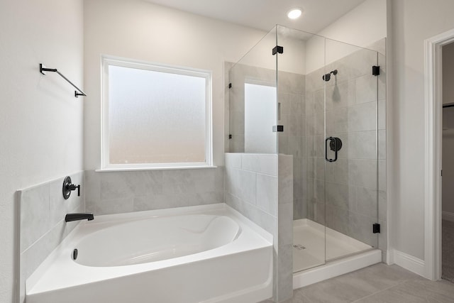 209 Briarwood Dr, Nevada, TX 75173 - bathroom featuring a bath, a shower stall, and tile patterned floors