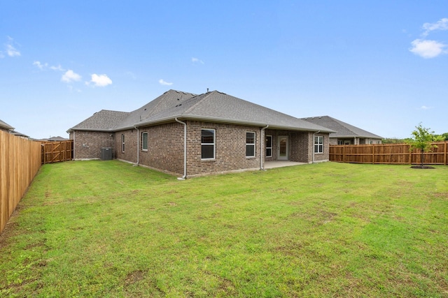 209 Briarwood Dr, Nevada, TX 75173 - back of house with a fenced backyard, brick siding, a patio, and a shingled roof
