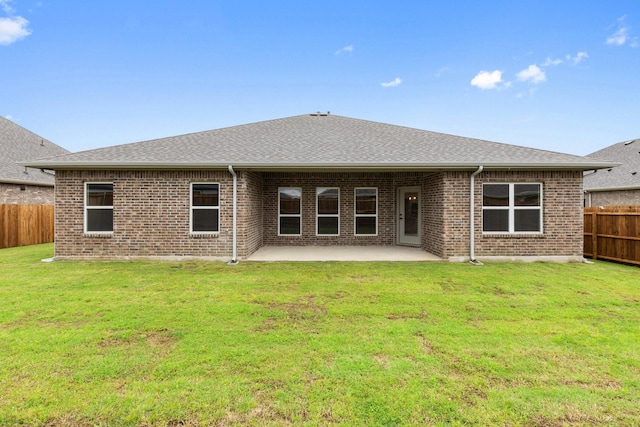209 Briarwood Dr, Nevada, TX 75173 - rear view of property with a fenced backyard, brick siding, a patio area, and a shingled roof