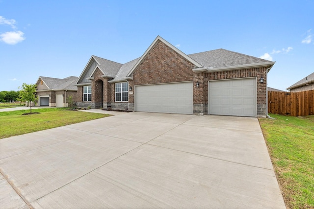 209 Briarwood Dr, Nevada, TX 75173 - view of front of house with an attached garage, brick siding, concrete driveway, and roof with shingles