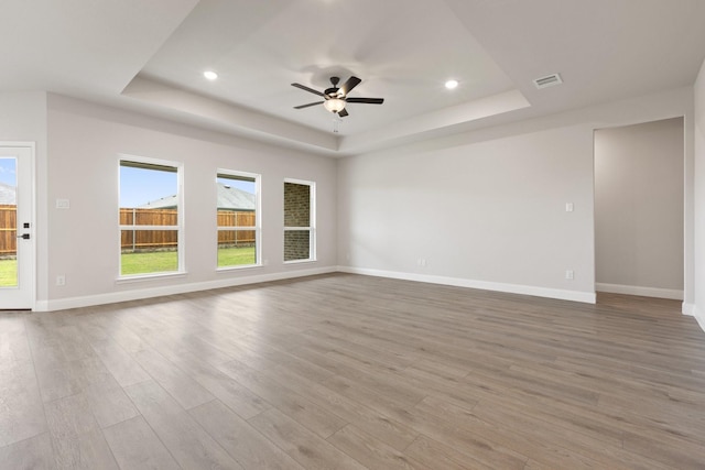 209 Briarwood Dr, Nevada, TX 75173 - spare room with a raised ceiling, wood finished floors, ceiling fan, and recessed lighting
