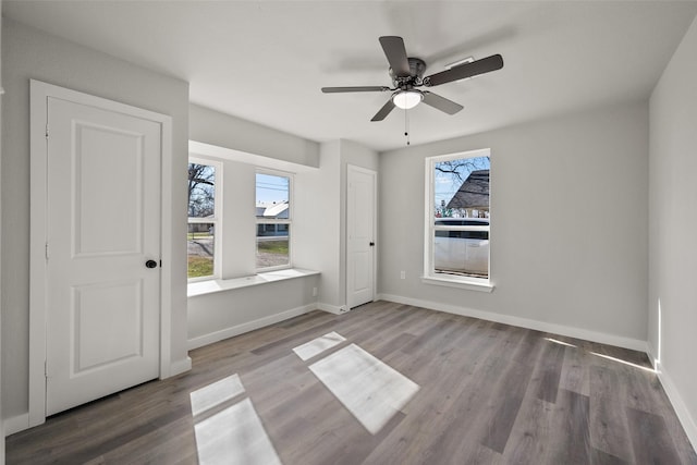 unfurnished bedroom with hardwood / wood-style flooring and ceiling fan