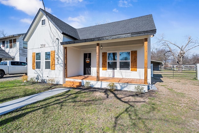 view of front of home featuring a front lawn and a porch