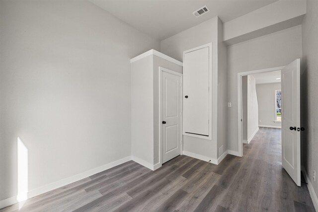 hallway featuring dark hardwood / wood-style flooring