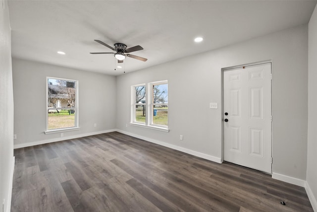 foyer with dark hardwood / wood-style floors and ceiling fan