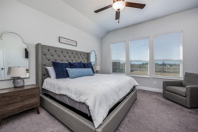 bedroom featuring light colored carpet, vaulted ceiling, and ceiling fan