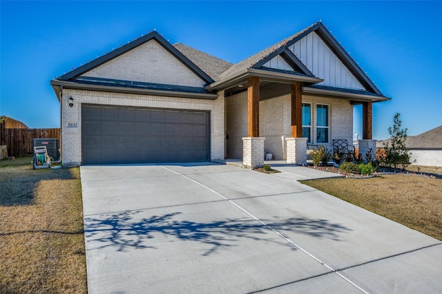 view of front of house with a garage and a front lawn