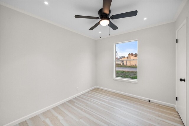 unfurnished room featuring crown molding, ceiling fan, and light wood-type flooring