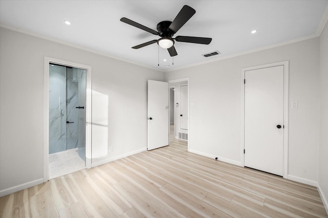 unfurnished bedroom featuring ornamental molding, ensuite bathroom, ceiling fan, and light wood-type flooring