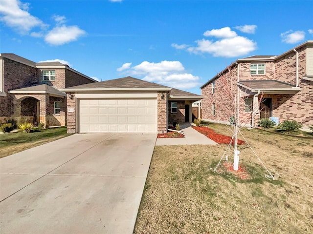 view of front of home featuring a garage and a front lawn