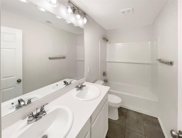 full bathroom featuring tile patterned floors, vanity, toilet, and bathing tub / shower combination