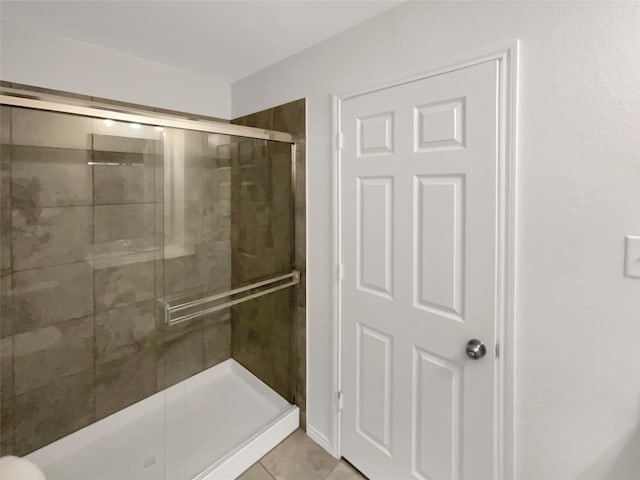 bathroom featuring tile patterned floors and walk in shower