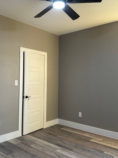 empty room featuring dark hardwood / wood-style floors