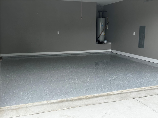 garage featuring electric panel and water heater