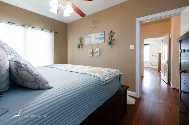 bedroom featuring ceiling fan and dark hardwood / wood-style flooring