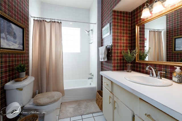 full bathroom featuring tile patterned flooring, vanity, toilet, and shower / bathtub combination with curtain