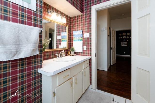 bathroom featuring tile patterned flooring and vanity