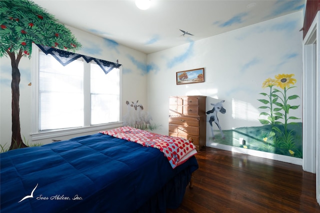 bedroom with dark hardwood / wood-style flooring