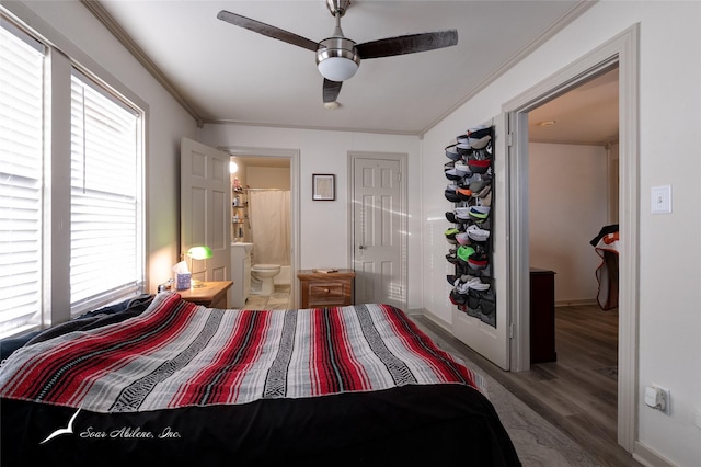 bedroom with hardwood / wood-style flooring, ceiling fan, ornamental molding, and ensuite bath