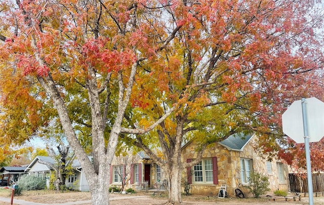 view of property hidden behind natural elements