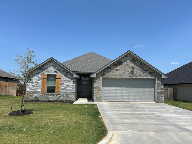 view of front of property with a garage and a front lawn