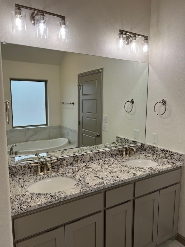 bathroom with a bathing tub and vanity