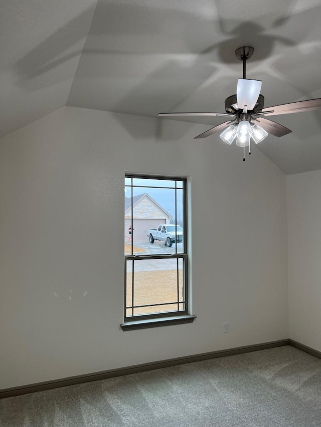 bonus room featuring a healthy amount of sunlight, carpet floors, ceiling fan, and lofted ceiling