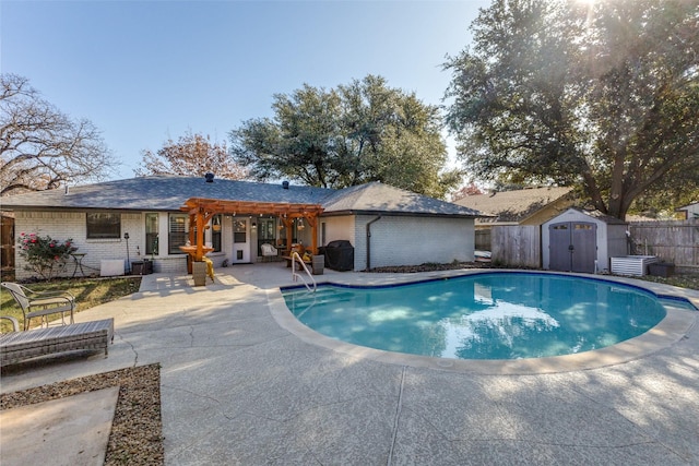 view of pool featuring a storage unit and a patio